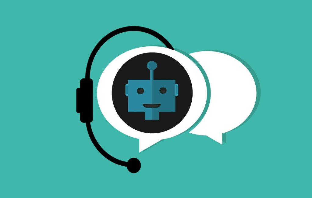 Zwei Chatsymbole - in einem der beiden ein Roboter, der einen Chatbot symbolisieren soll, türkiser Hintergrund.